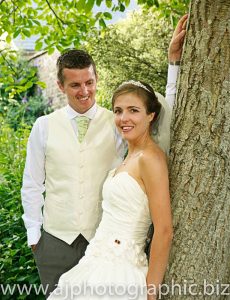 Barry And Jo Hanna wedding standing by tree