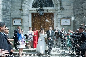 Dafne And Mario Ruiz wedding guests throwing coneftti