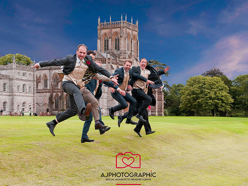 Groom with best men jumping for joy